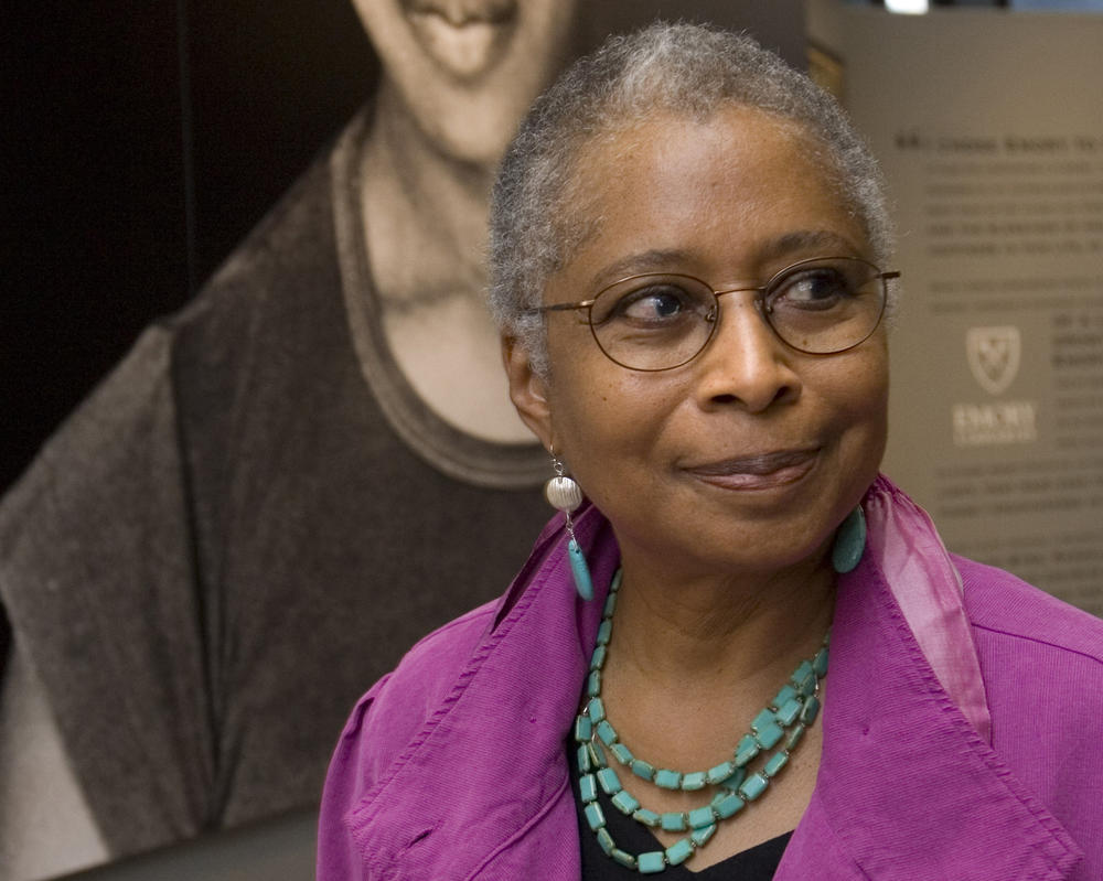  Alice Walker stands in front of a picture of herself from 1974 as she tours her archives at Emory University, in Atlanta.