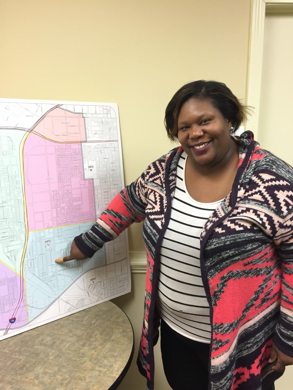 Peoplestown resident Allison Johnson points to her home on a map of downtown Atlanta's NPU-V where Turner Field will be redeveloped. 