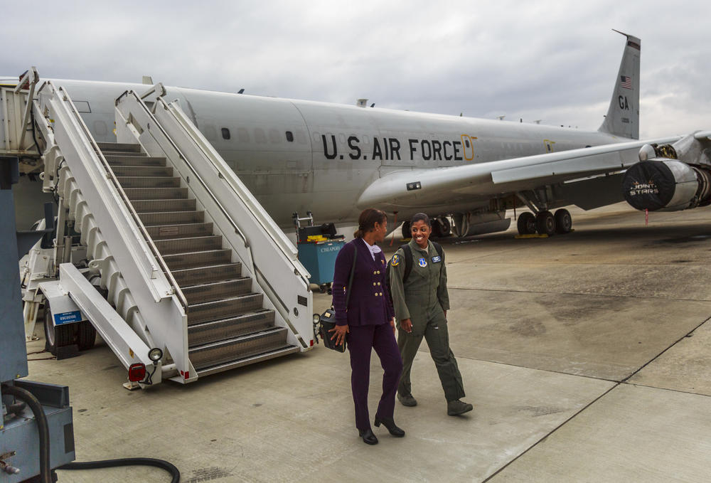 Georgia Air National Guard First Lieutenant Andrea Lewis, right, leaves the aircraft on which she will soon deploy with her mother Sharon Pierrie Scott at Robins Air Force Base in Warner Robins. 
