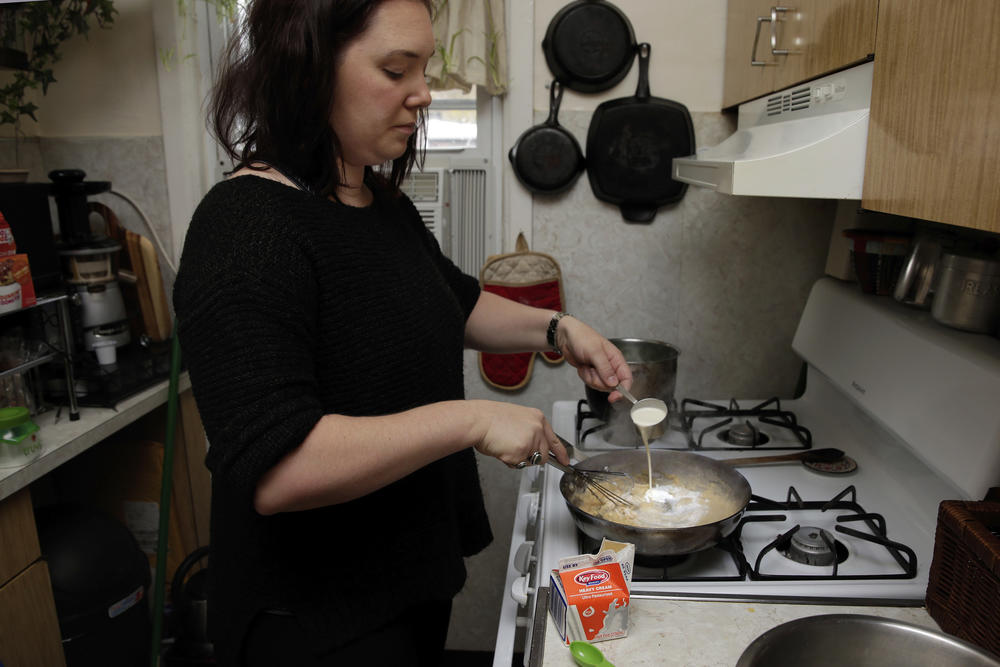 Ruthy Kirwan makes the sauce for a green bean casserole. Fire officials say it's important to keep an eye on cooking food, especially on the stovetop.