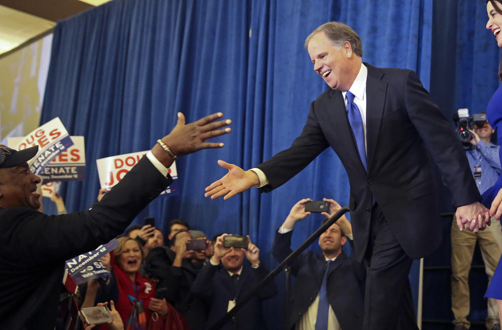 Doug Jones is greeted by a supporter before speaking during an election-night watch party Tuesday, Dec. 12, 2017, in Birmingham, Ala. Jones has defeated Republican Roy Moore, a one-time GOP pariah who was embraced by the Republican Party and the President