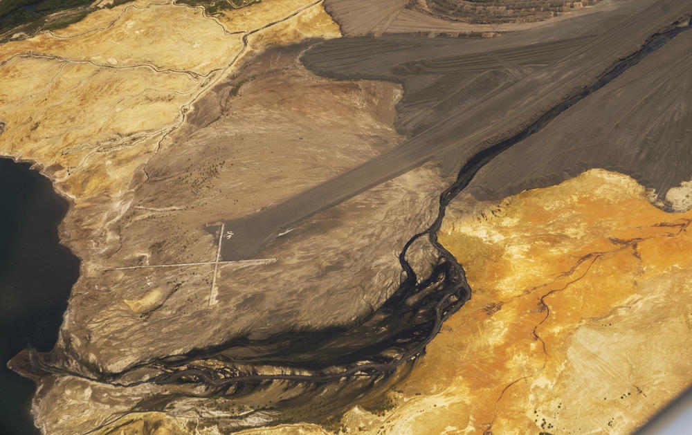 A slurry of mud and coal ash flowing into the coal ash pond near Georgia Power's Plant Scherer. 