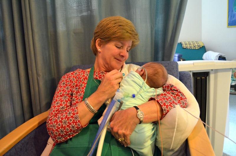 Diane Saville comforts an infant as part of the Baby Buddies program at Children's Healthcare of Atlanta at Egleston.