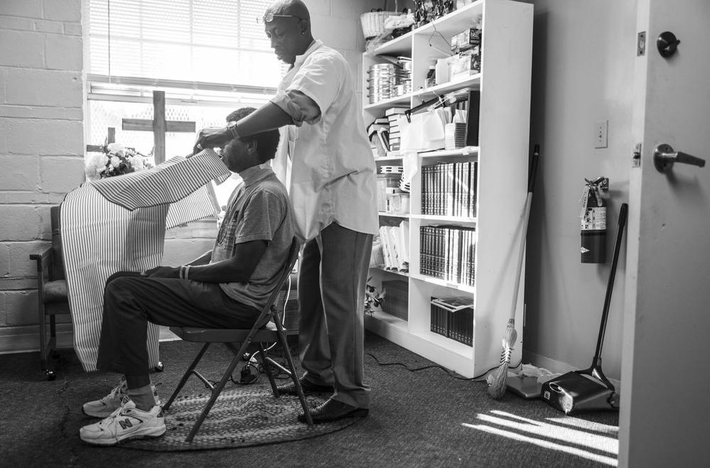 Anthony Ponder gets ready to give a hair cut on a Sunday morning at Centenary Church in Macon. Barbering has been at the center of Ponder's life whether in prison or out. 