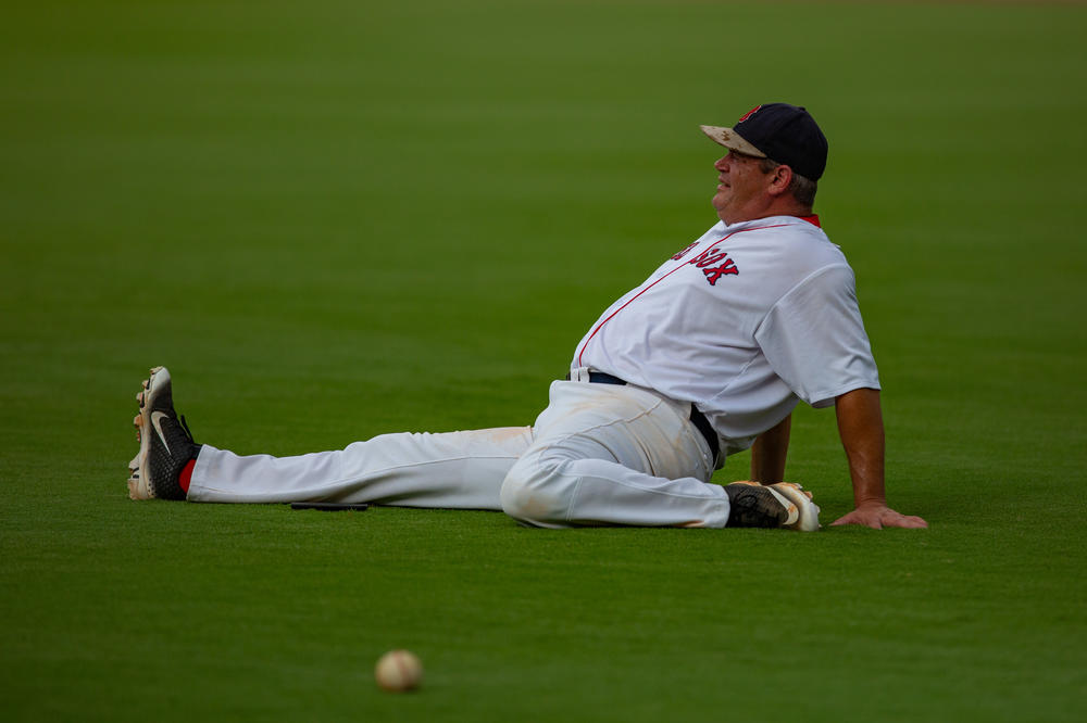 Stretching a little extra before game time is important for players like Kerry Maddox. But he wasn't all business. He brought his phone to snap a few pictures of the perfectly-manicured field.