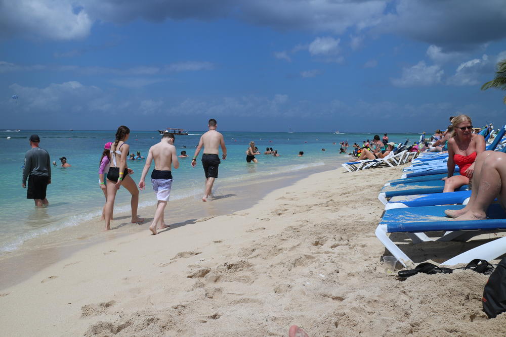 Global health emergency does not stop travelers from experiencing leisure strolls at the beach in Cozumel, Mexico.