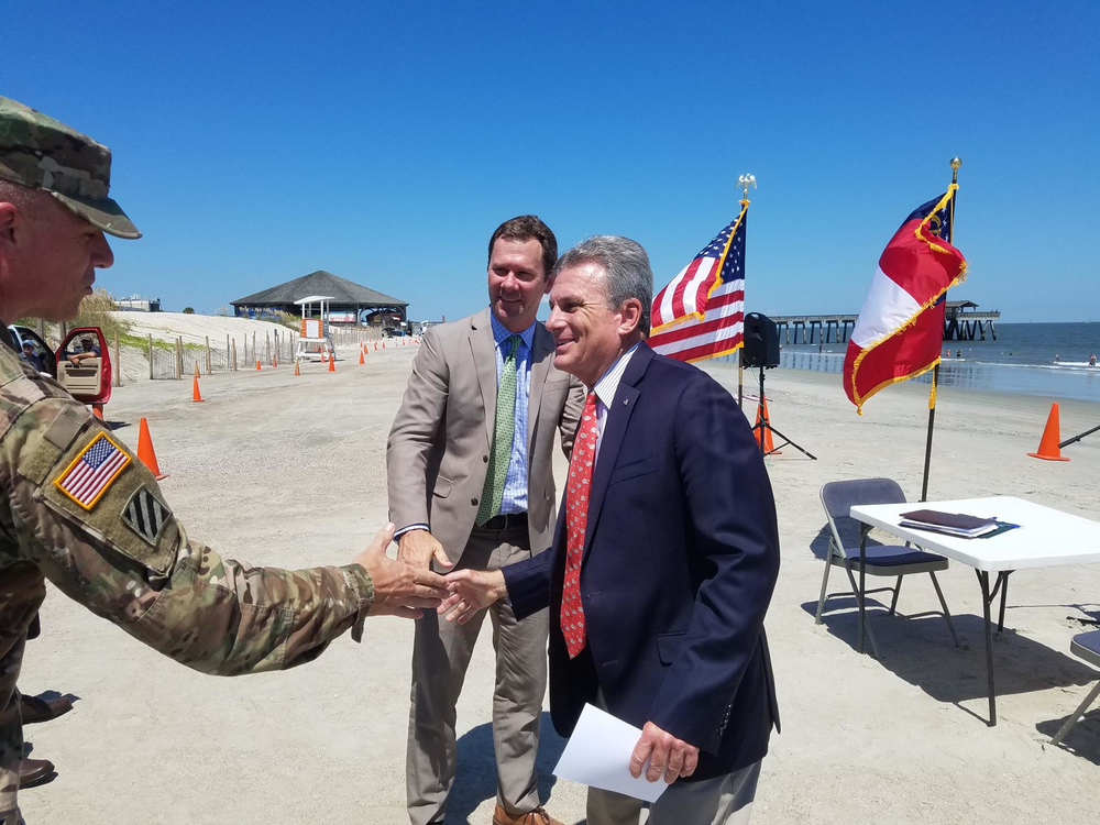 Corps of Engineers Savannah District Commander Col. Daniel Hibner shakes hands with Congressman Buddy Carter (right) and Tybee Mayor Jason Buelterman