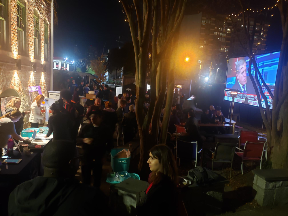 A crowd at Georgia Beer Garden in Atlanta watches the Democratic national debate Nov. 20, 2019.