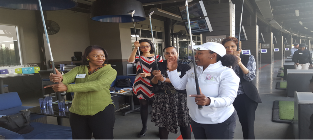 Women practicing golf with the Black Girls Golf club of Atlanta.