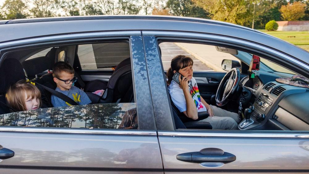 April Smith starts making calls in an effort to find baby formula for her five month old daughter after finding the Health Department in Dougherty County was still closed a week after Hurricane Michael. 