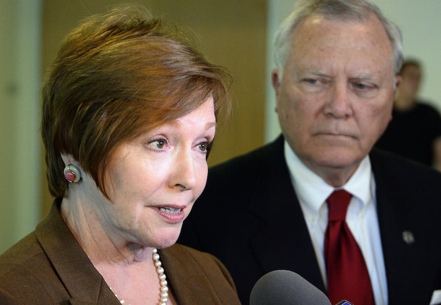 In this Oct. 16, 2014 file photo, Brenda Fitzgerald, Georgia Department of Public Health commissioner, left, and Georgia Gov. Nathan Deal respond to questions in Atlanta.