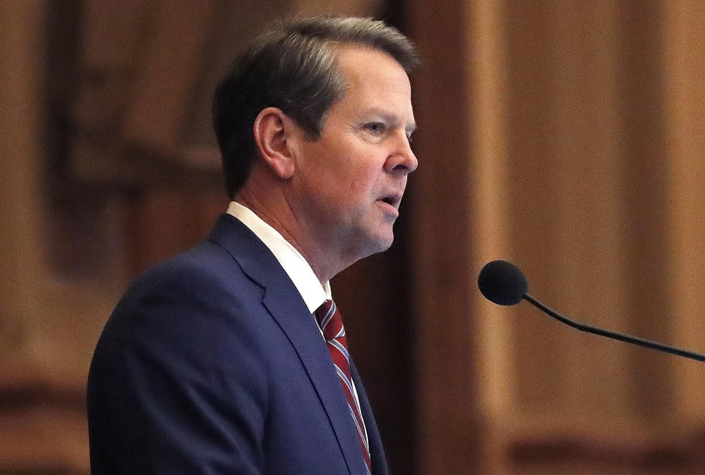 Gov. Brian Kemp speaks to members of the Georgia House at the state Capitol in Atlanta. 