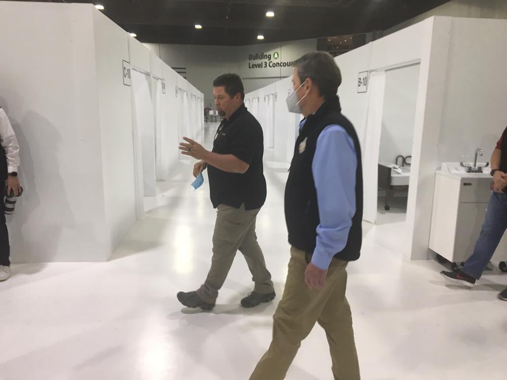 Gov. Brian Kemp tours a new 200-bed hospital overflow facility constructed inside the Georgia World Congress Center Thursday, April 16, 2020.