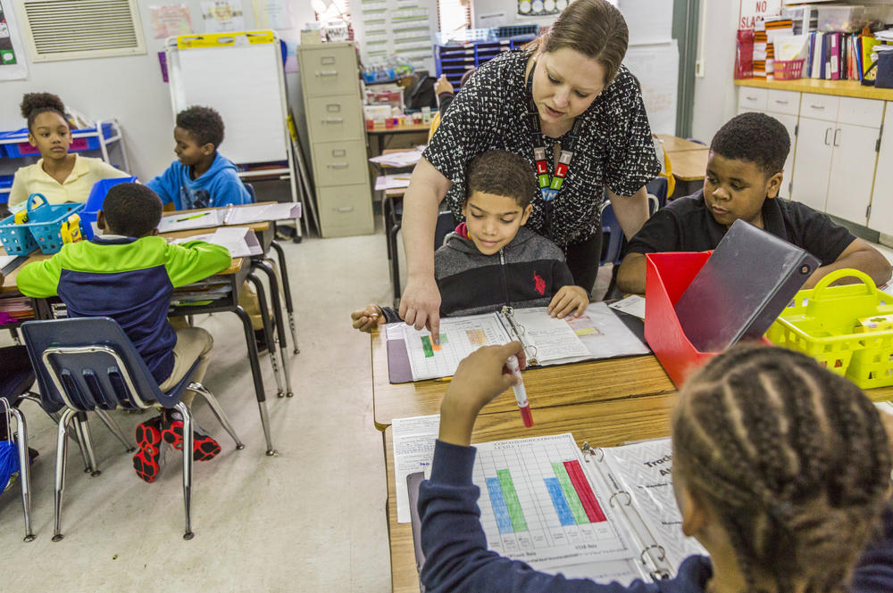 Alison Scott goes over reading data with students in her second grade class at Burdell Elementary in Macon.