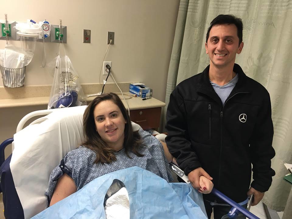 Lauren Caccavone and her husband, Augie, at Northside Hospital after her Nov. 19, 2018, surgery to remove her breast implant.