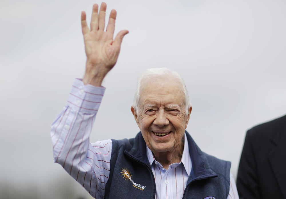 Former President Jimmy Carter waves during a ribbon cutting ceremony for a solar panel project on farmland he owns in their hometown of Plains, Ga., Wednesday, Feb. 8, 2017. 