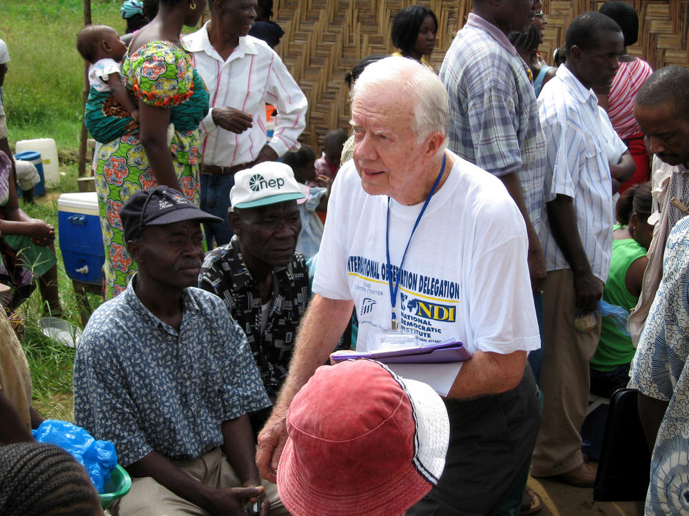 Former U.S.  President Jimmy Carter visiting voting station as an elections observer in Monrovia, Liberia on Tuesday, Oct. 11, 2005.Voters cast ballots Tuesday for Liberia's first elected president since the end of a 14-year civil war that destroyed the west African nation, killed tens of thousands of people and left the living mired in abject poverty.
