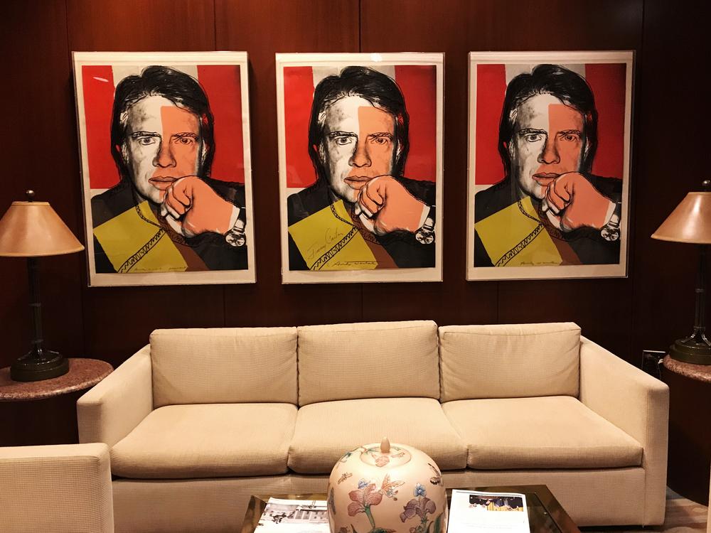 A trio of original Andy Warhol portraits of former President Jimmy Carter. The portrait in the middle is signed by Carter himself.