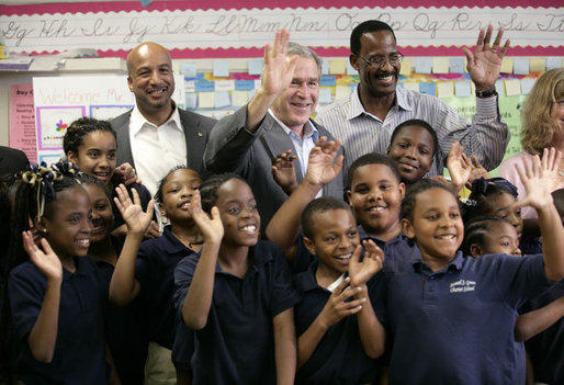 Former President George W. Bush visits charter school students in New Orleans, Louisiana, where the majority of public schools have become charter schools.
