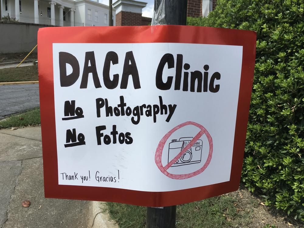 Handmade sign for DACA Renewal Clinic at Mercer University's School of Law.