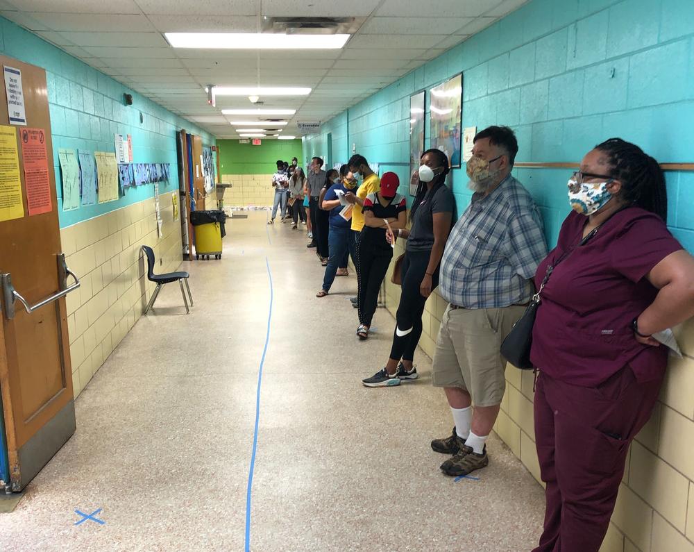 Voters line up at a polling location Tuesday, June 9, 2020, in DeKalb County.