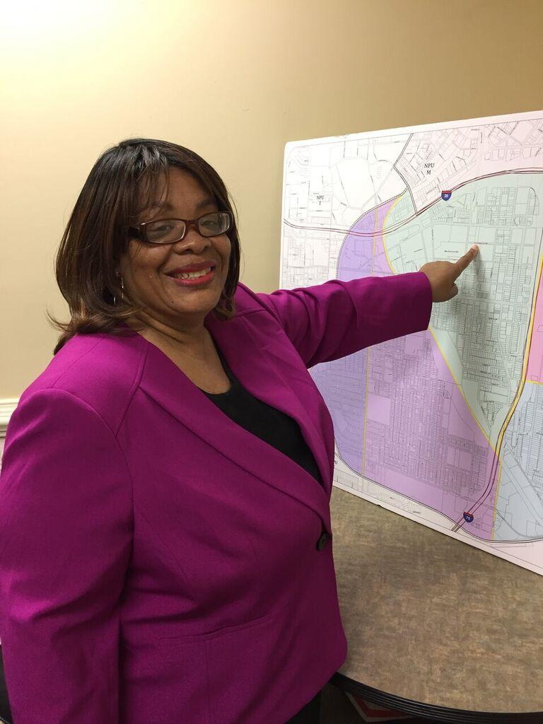 Mechanicsville resident Deborah Arnold points to her home on a map of downtown Atlanta's NPU-V where Turner Field will be redeveloped. 