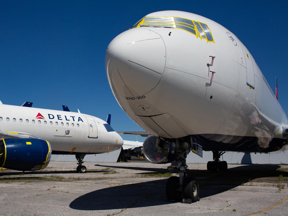 These two jets were among dozens of planes Delta parked at the Birmingham airport in May. Maintenance workers prepped them for long-term storage.