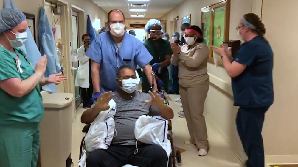 A COVID-19 patient is released to cheers from staff at Phoebe Putney Memorial Hospital in Albany last week. 