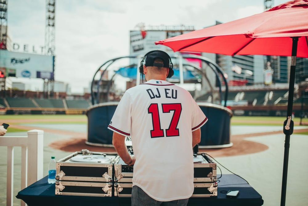 DJ EU plays at Atlanta Braves event.