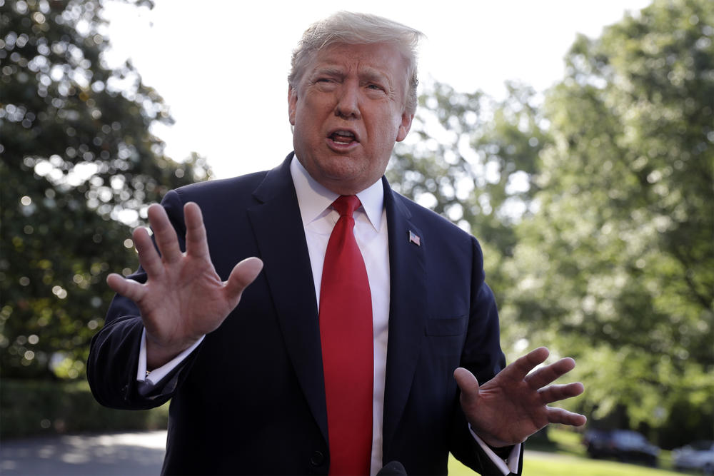 President Donald Trump talks with reporters before departing on Marine One for the Air Force Academy graduation ceremony, Thursday, May 30, 2019, in Washington.