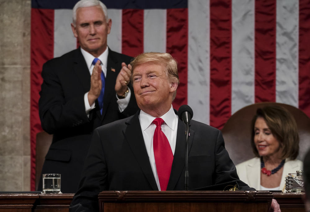 President Donald Trump gives his State of the Union address to a joint session of Congress, at the Capitol in Washington, as Vice President Mike Pence, left, and House Speaker Nancy Pelosi look on. In Trump's estimation, the good times began to roll for t