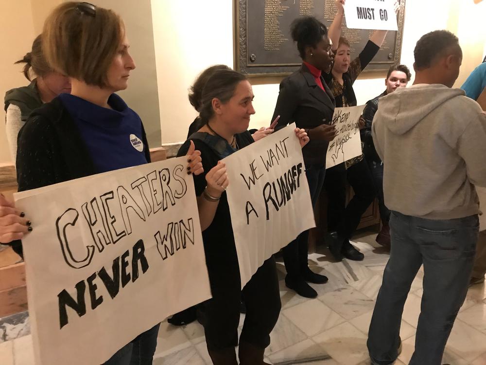 Protesters gather outside of the governor's office in Georgia's State Capitol building.
