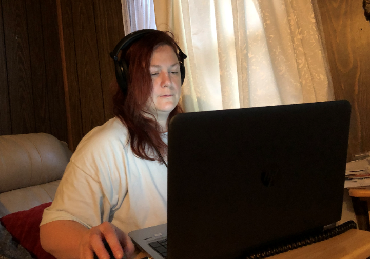 GPB News Digital Manager Ellen Eldridge listens to President Donald Trump with headphones on while working from home Friday, March 13, 2020.