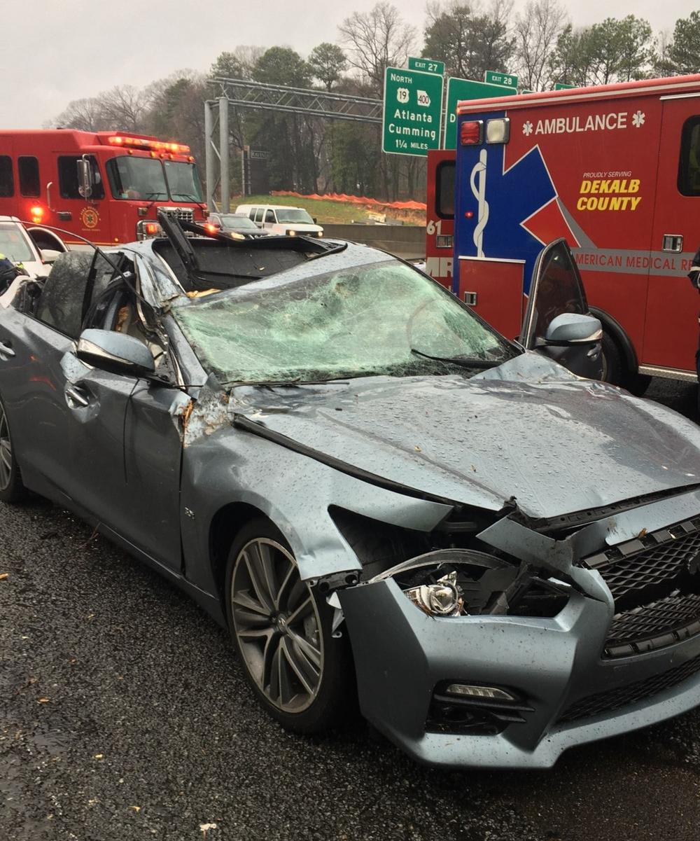 A tree hit a car on I-285 in Dunwoody Thursday morning during severe weather. 
