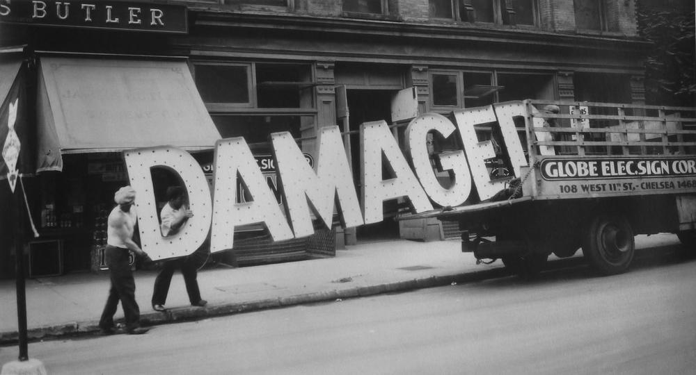 Evans often playfully juxtaposed text and image in his work. For this photograph, Evans captured a seemingly oxymoronic sign as men loaded it onto a New York City truck.