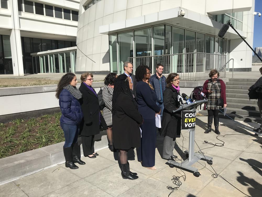 Lauren Groh-Wargo announces the lawsuit Fair Fight Action and Care In Action are bringing against the state.