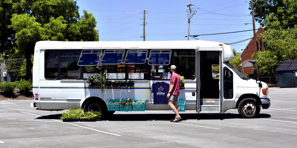 The Farm bus is parked in a church parking lot that's along a bus line, meaning a lot of foot traffic that could purchase food.