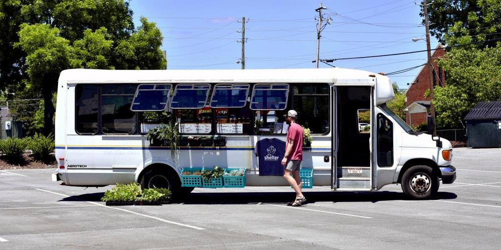 The Farm Bus is parked in a church parking lot that's along a bus line, meaning a lot of foot traffic from people who could purchase food.