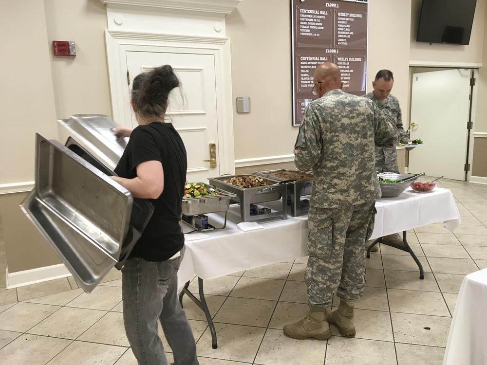 Saralyn Collins with Grow Restaurant serves lunch to members of the Georgia Department of Defense's 5th Brigade at Vineville Methodist Church.