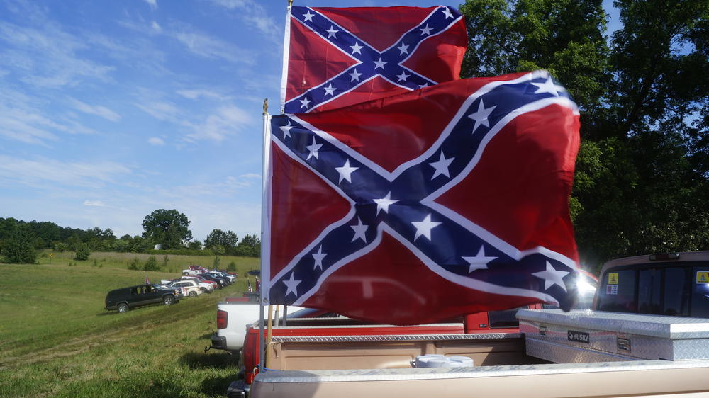 Two Confederate flags fly at Nash Farm Battelfield Park during a rally in support of the flag.