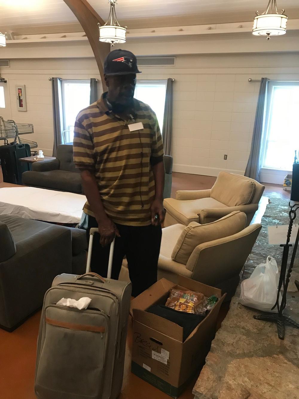 Akins stands with his suitcase that he carries his groceries in when taking MARTA. 