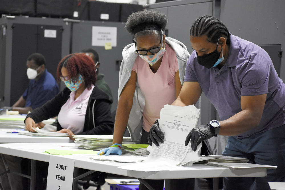 Fulton County elections workers conduct a pilot risk-limiting audit Monday, June 29.