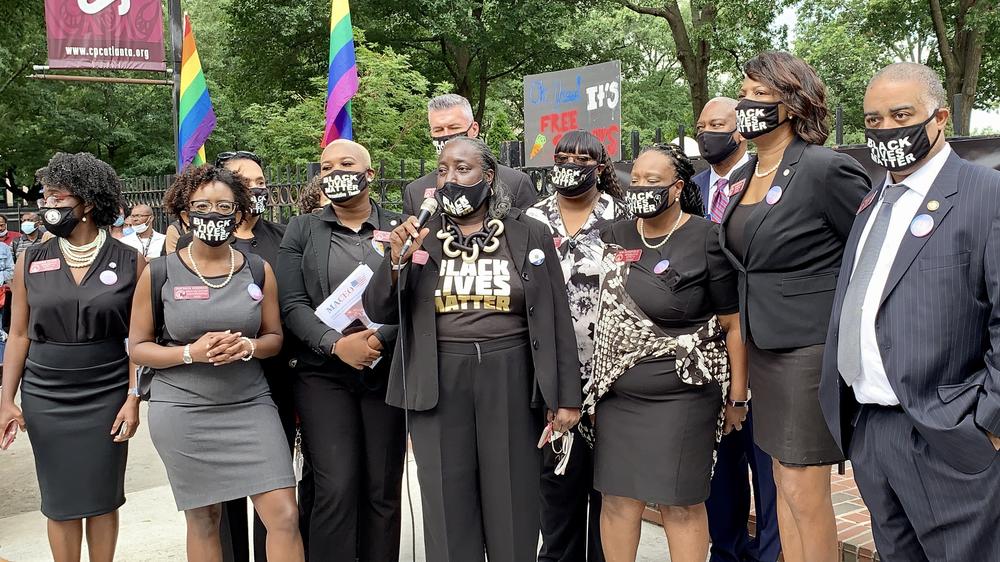 Members of the Georgia Democratic Caucus address protestors at the Capitol.