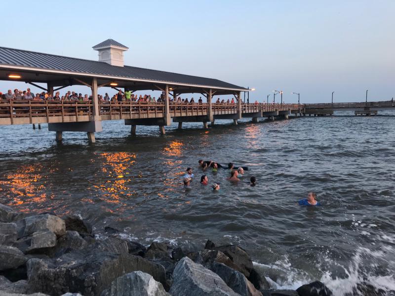 Bystanders immediately jumped into the ocean to save stranded whales. The Georgia Department of Natural Resources does not normally recommend pushing whales back out to sea, but in this case the efforts were successful. 
