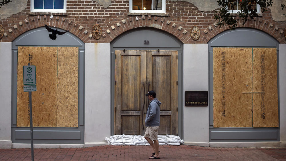 A pedestrian walks the nearly empty streets of historic downtown Savannah, Ga., Sunday, Sept., 10, 2017 before Hurricane Irma is forecast to impact the area.