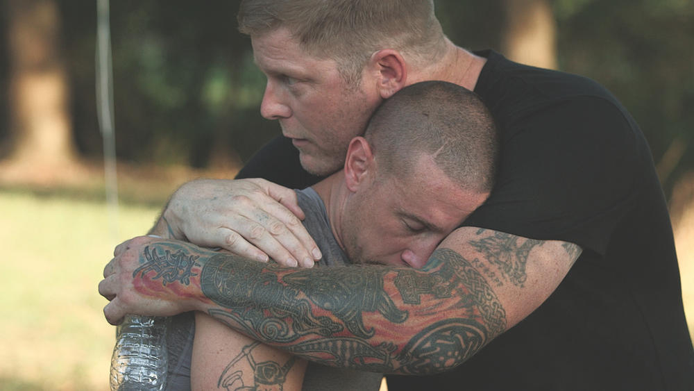 Chris Buckley (left) of the Grand Knighthawk for the North Georgia White Knights and peace activist Arno Michaelis (right) in a scene from the now canceled A&E series,  Escaping the KKK: A Documentary Series Exposing Hate in America. 