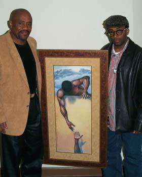 Artist Gilbert Young pictured with actor, film director Spike Lee and "He Ain't Heavy" painting.