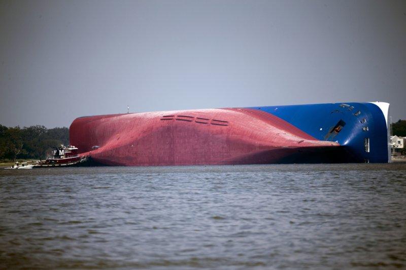 Marine salvage experts are trying to determine what caused a fire, Sunday, Oct. 20, in the overturned cargo ship lying close to Georgia's seacoast.