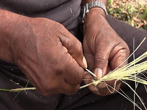 Sapelo Island resident makes a traditional Gullah basket.