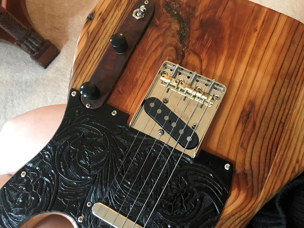 Atlanta musician Maggie Schneider's guitar is made from the wood of the Excelsior Mill in downtown Atlanta, former home of the Masquerade music venue.